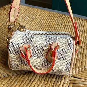 Stylish Checkered Handbag with Tan Accents